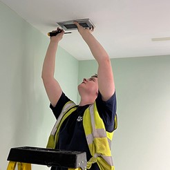 Person inspecting ventilation