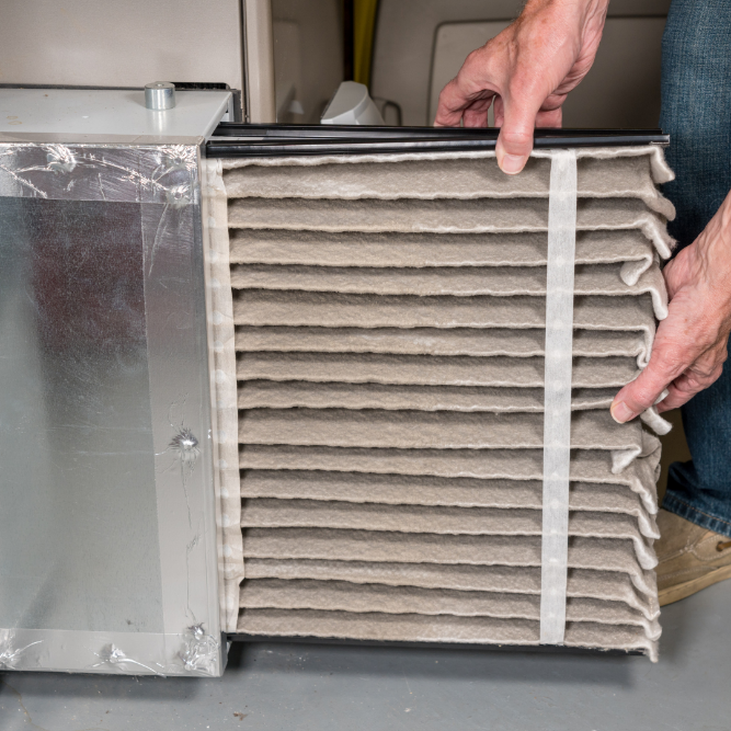 Person holding air filter